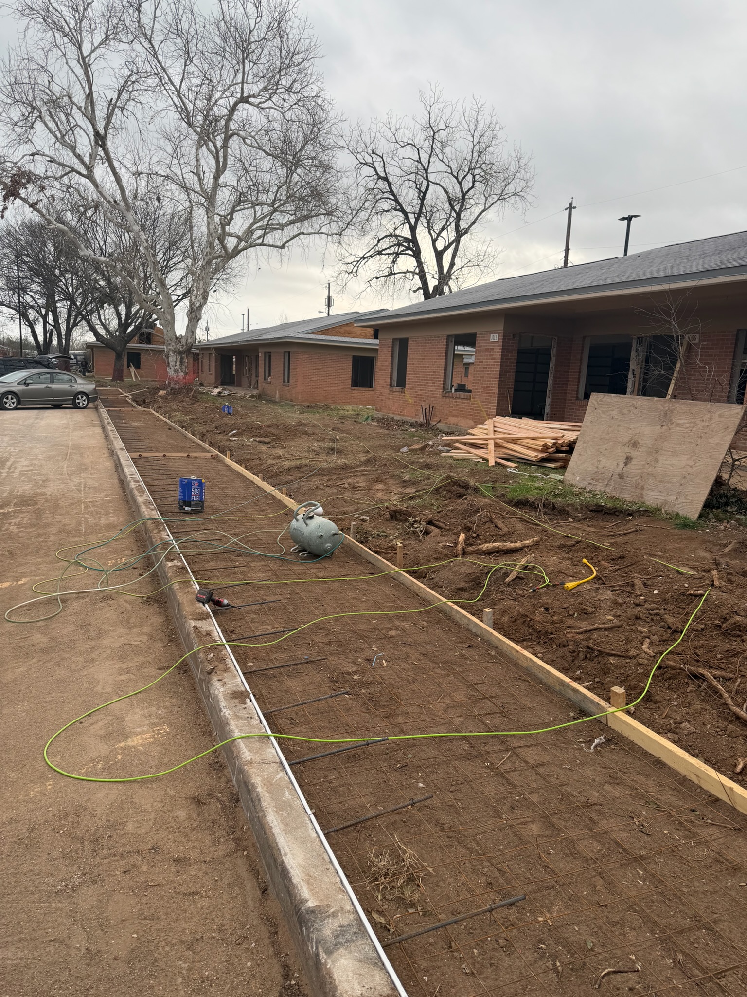 Formed sidewalk concrete and fresh flatwork on a Waco public walkway