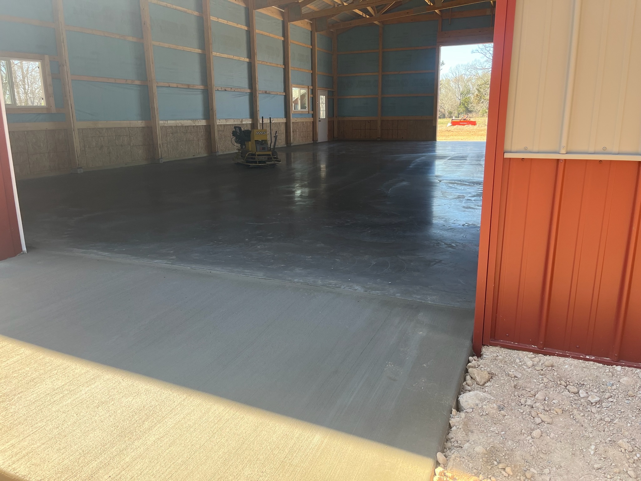 Finished interior concrete shop slab inside a new Morton Building in Jewett, Texas