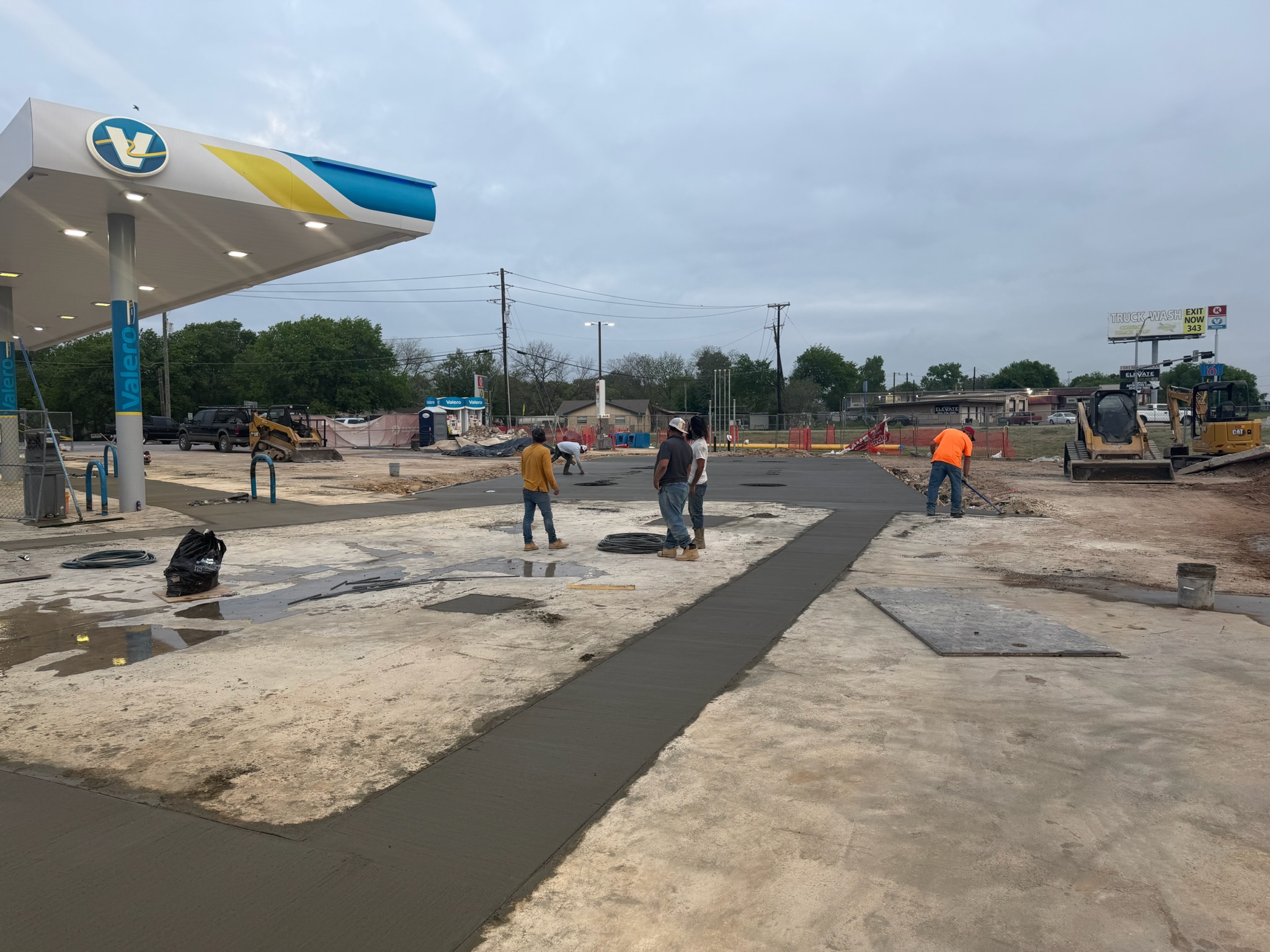 Concrete crew finishing flatwork at Circle K in Lacy Lakeview
