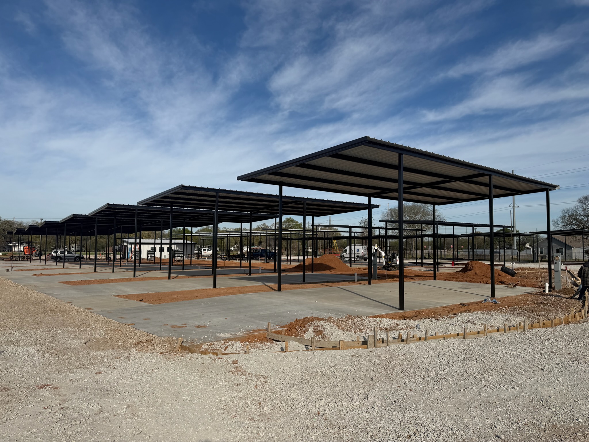 Concrete RV pads and covered parking structures at Magnolia RV in Waco, TX