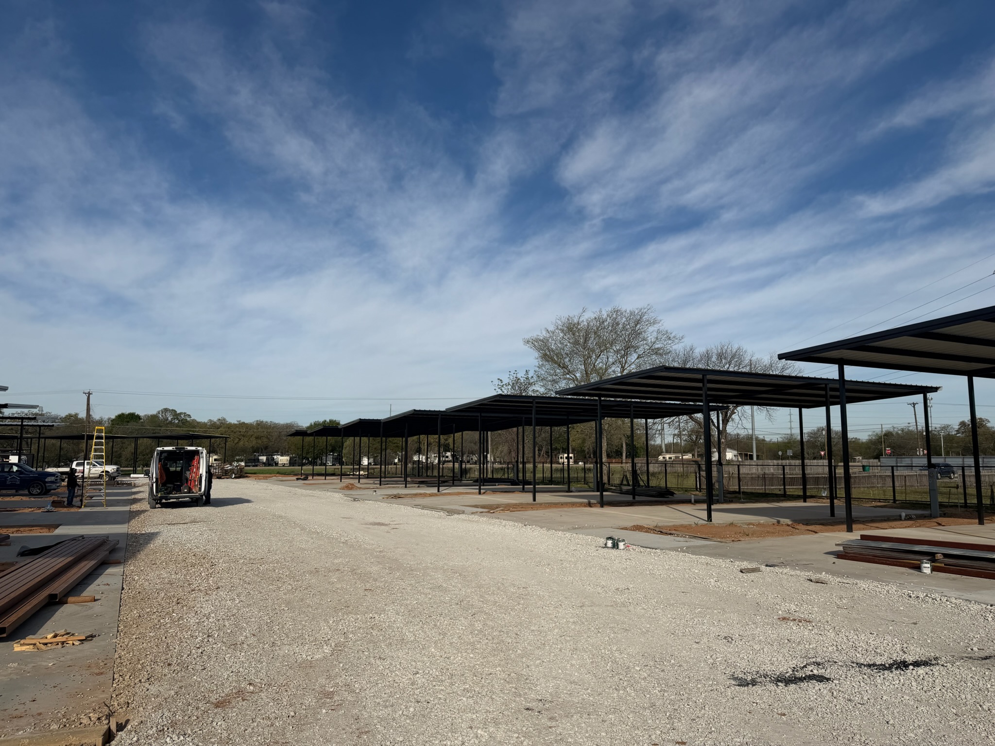 Concrete pad layout and covered RV spaces at a Waco commercial site