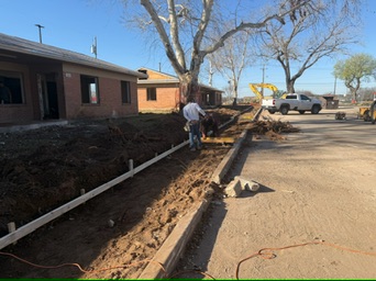 Crew preparing concrete forms and reinforcement at the Melody Grove project