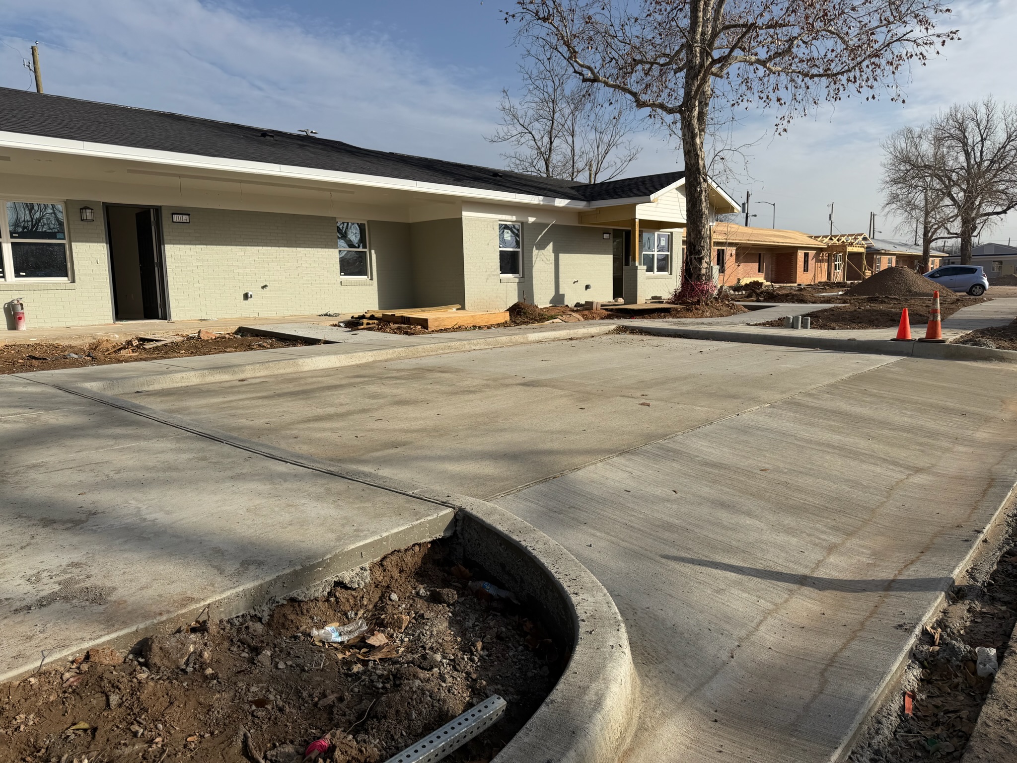New concrete parking area and sidewalk at Melody Grove housing in Waco, TX