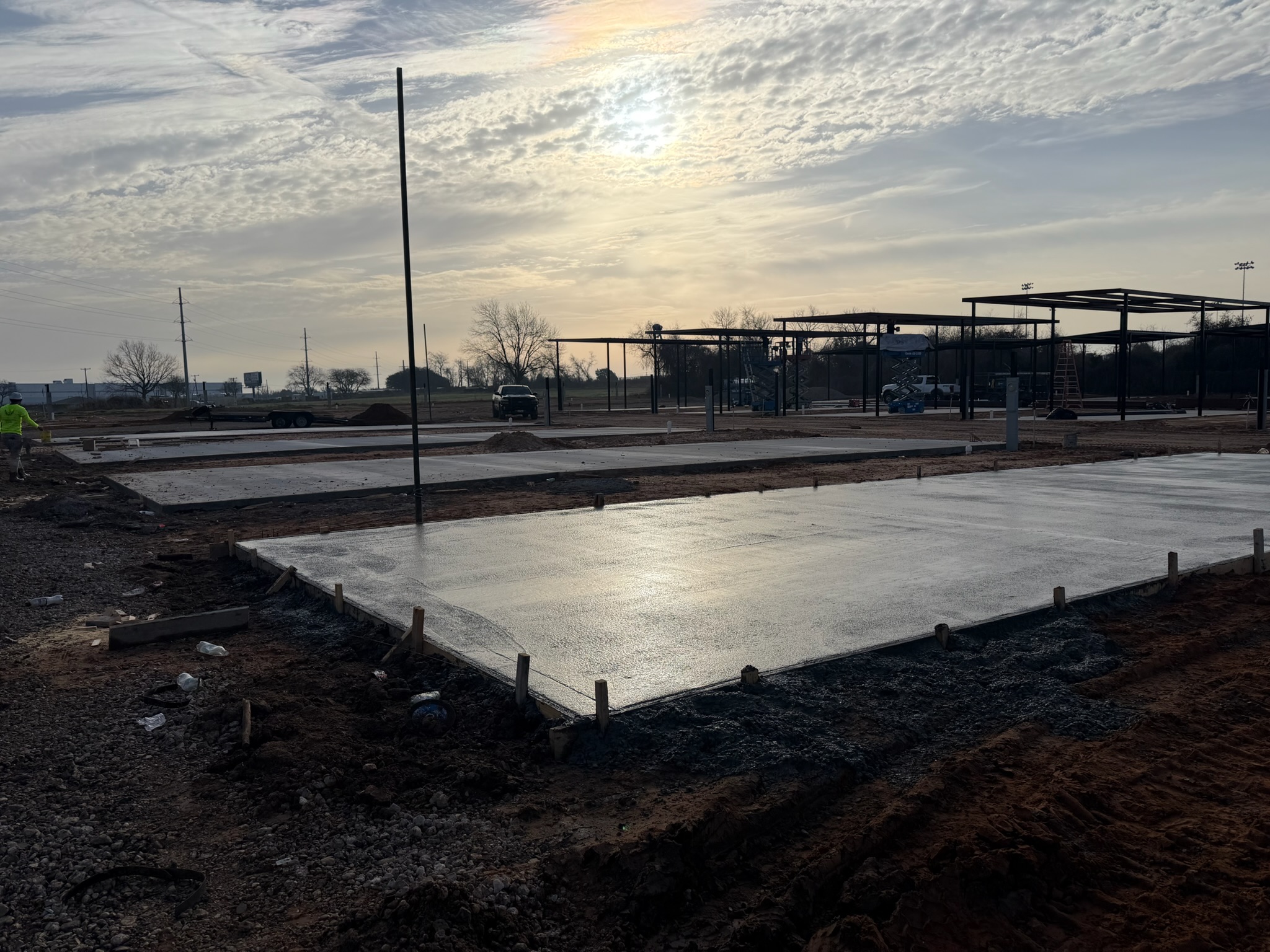 Finished concrete flatwork beside parking structures at Melody Grove in Waco