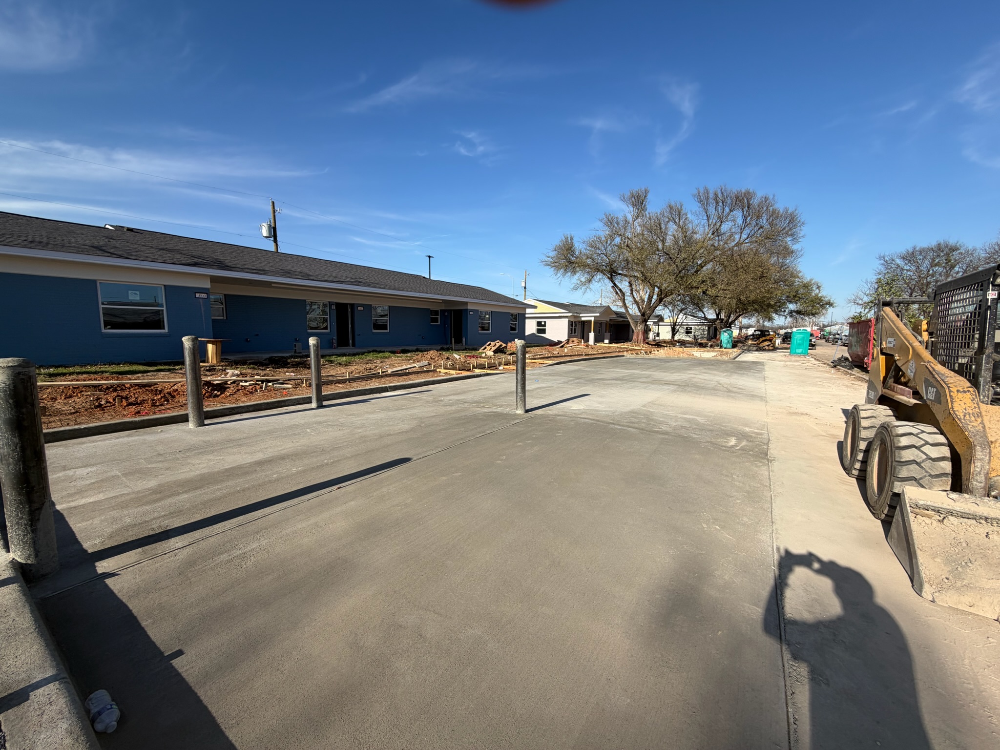 Fresh concrete parking lot section at Melody Grove housing in Waco, TX