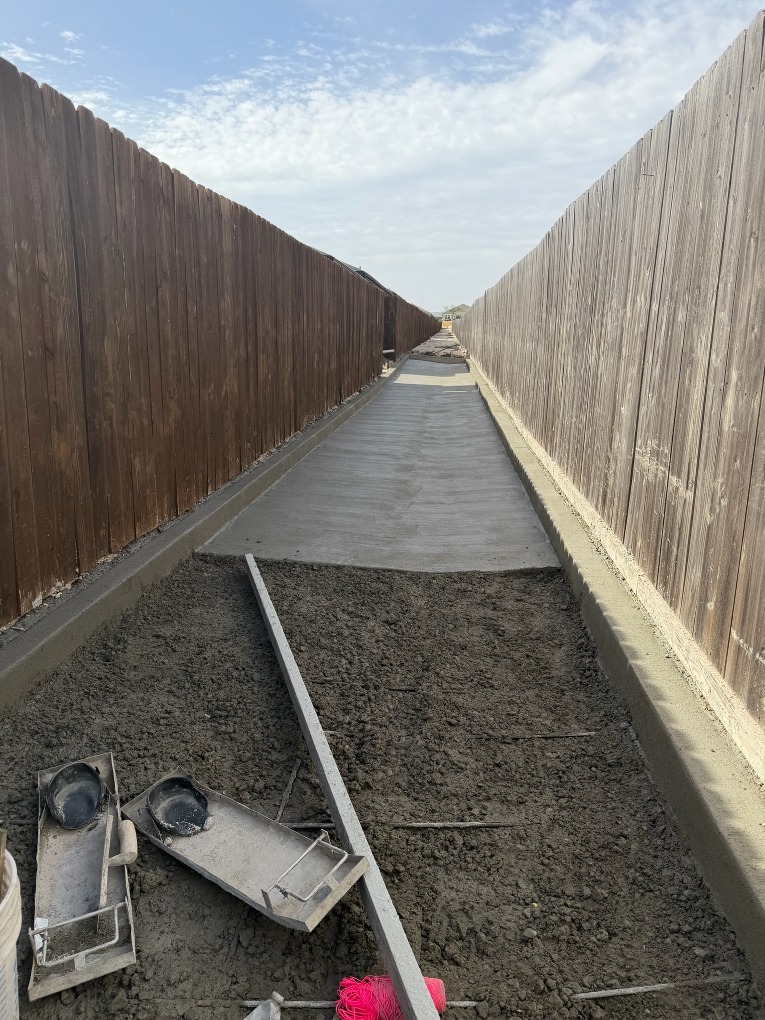 Finished section of concrete drainage channel work with clean edges in Temple, Texas