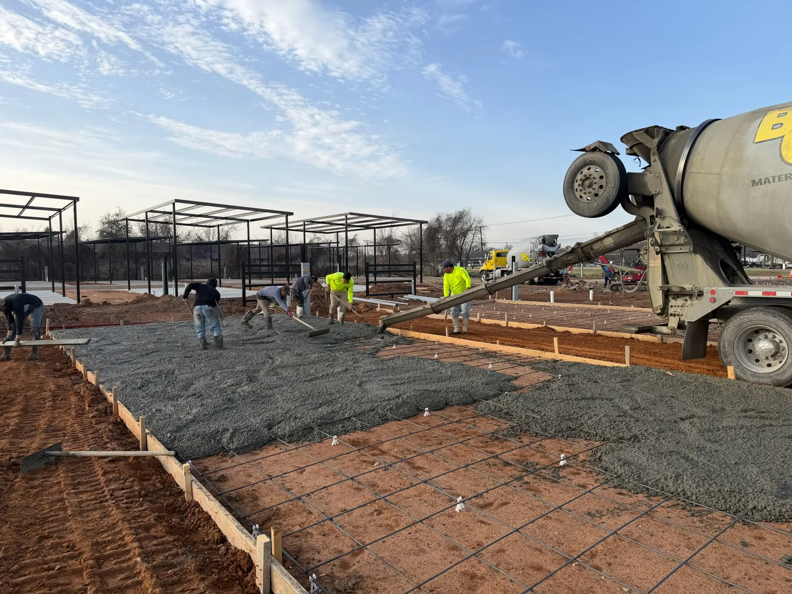 Concrete crew placing reinforced flatwork at a Waco project